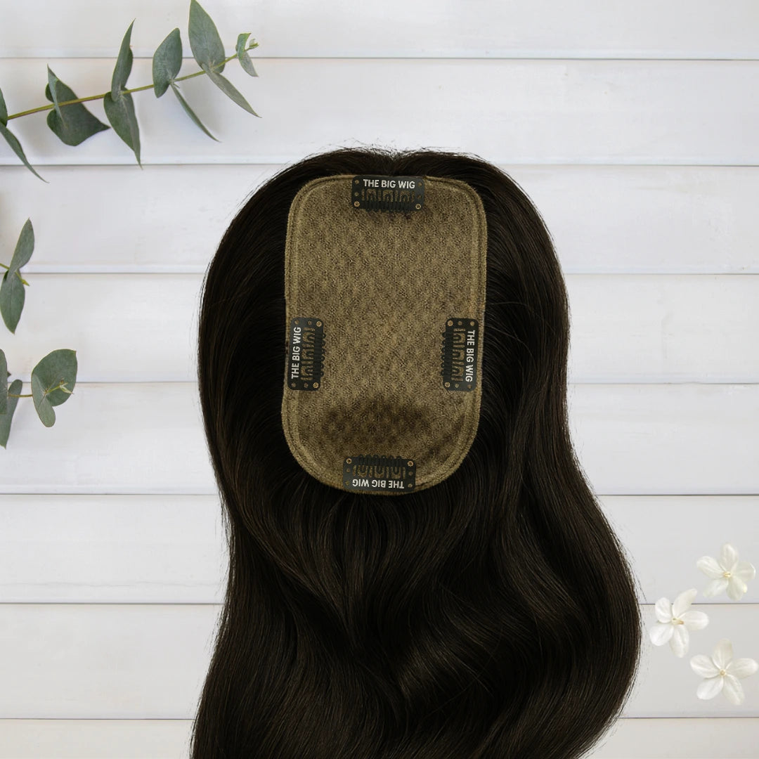 Back view of human hair silk base topper for women showing coverage and blend with natural hair