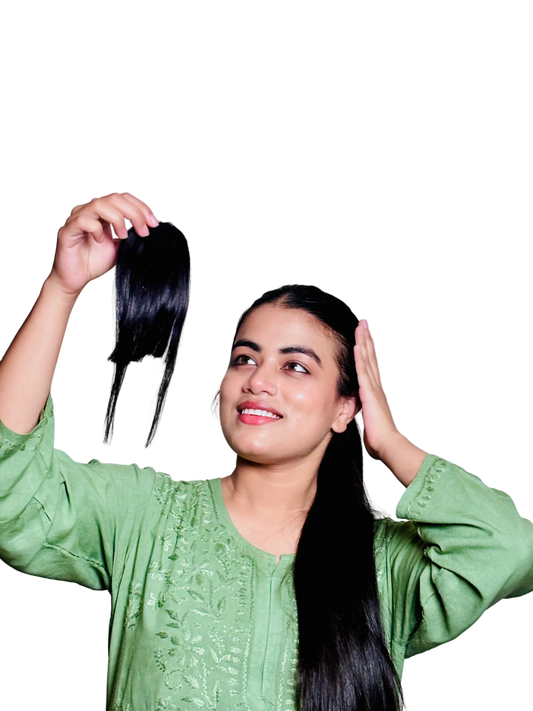 Woman holding a hair bangs with fringes with a plain background