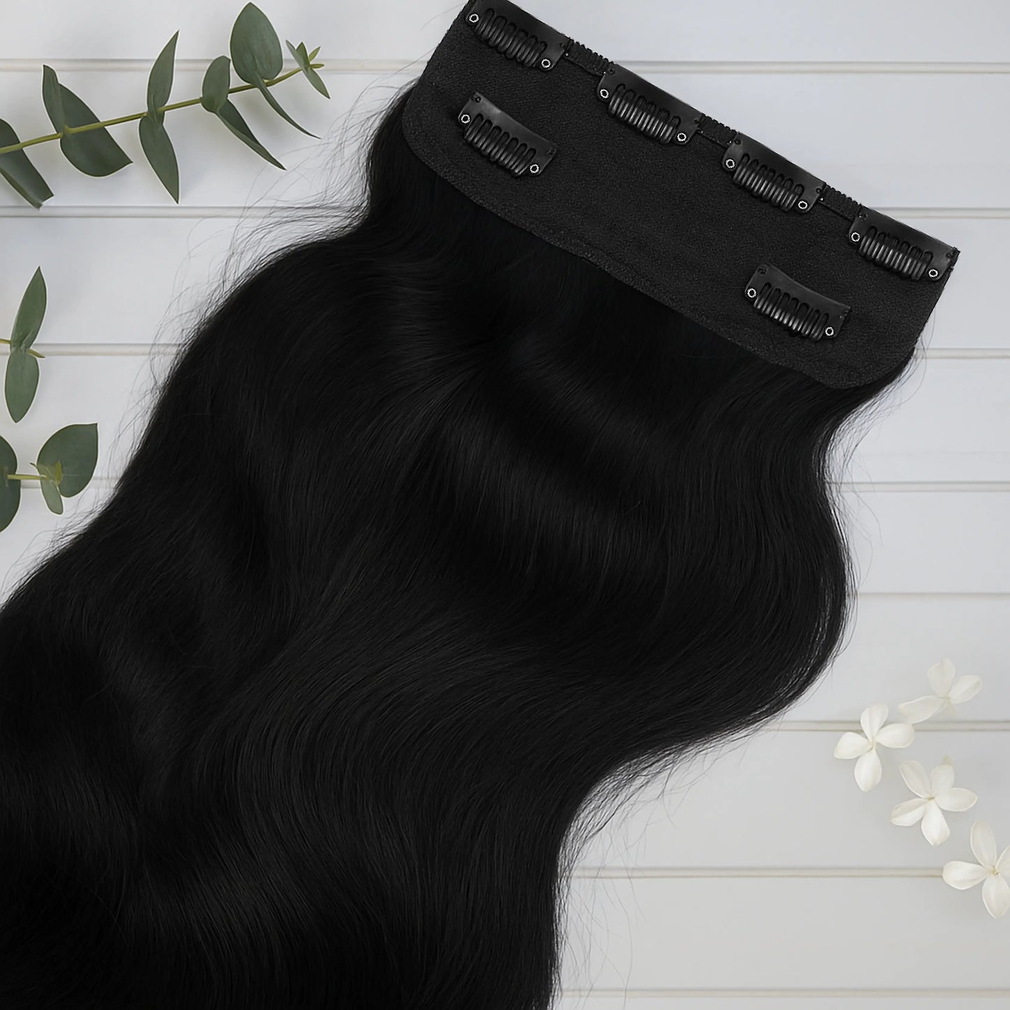 Clip-in back hair extension volumiser made from 100% real human hair for women.